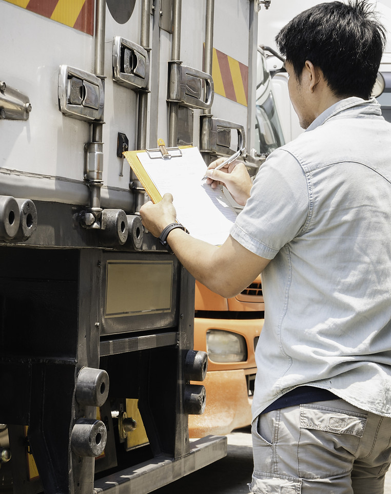 Truck Driver Writing on Document